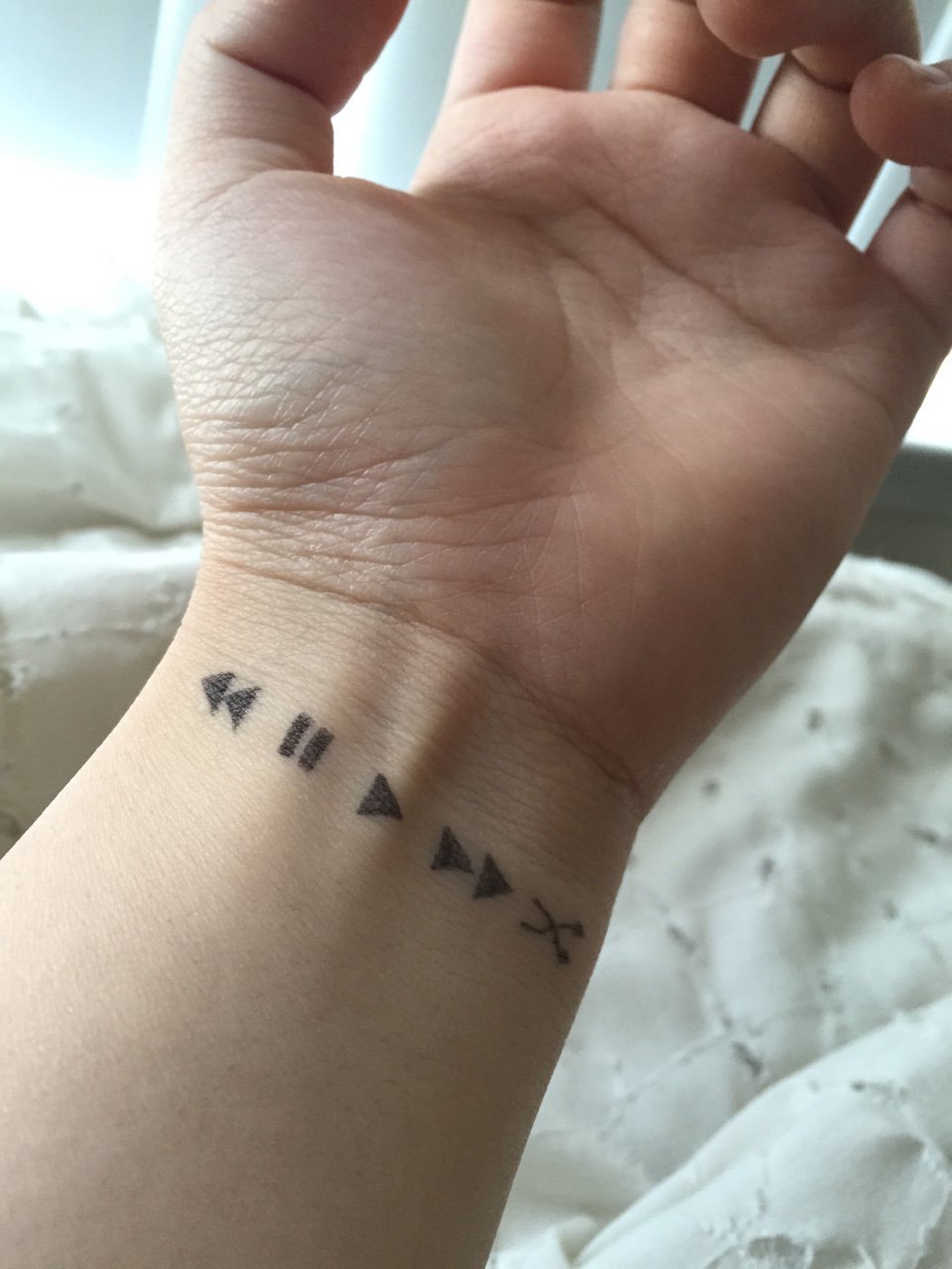 tiny minimalist tiny sparkle tattoo