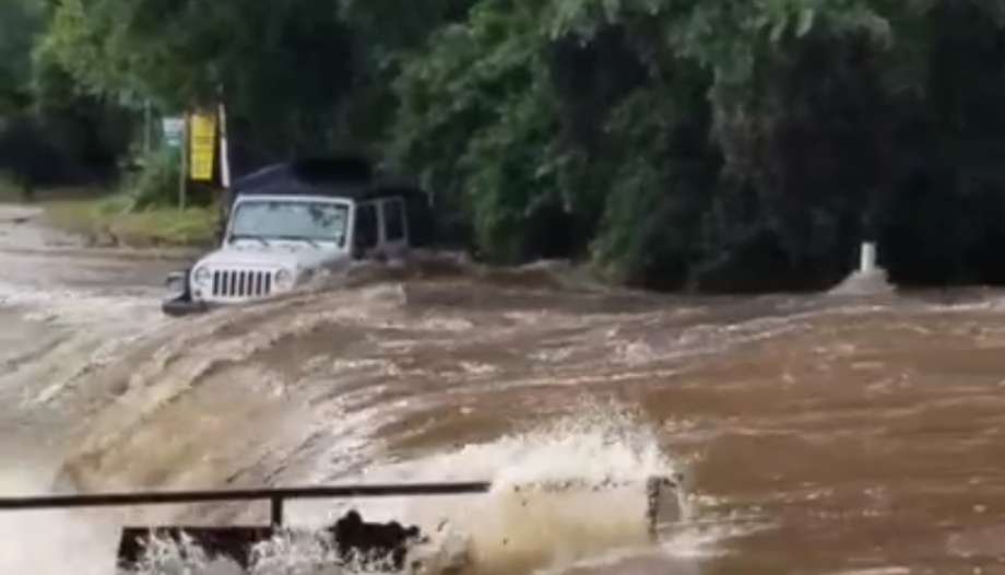 Jeep stuck in flooded river