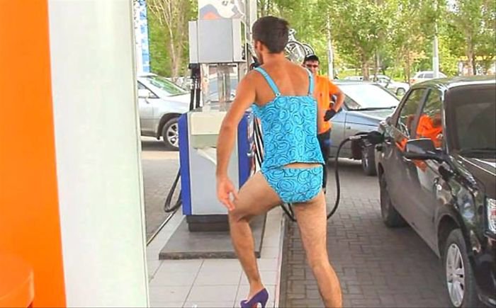 guys in bikini in a russian gas station